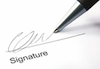Imagen de un bolígrafo firmando.